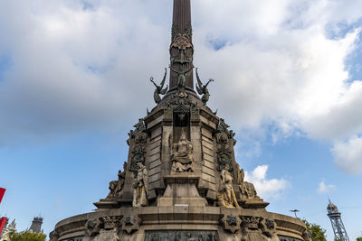 Low angle view of statue of building against sky