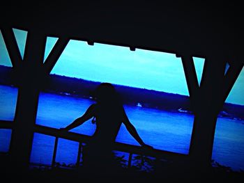 Close-up of woman against blue sky