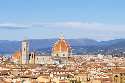 Aerial view of townscape against sky