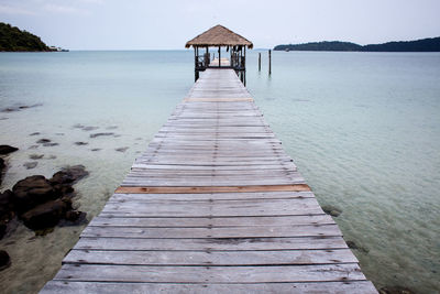 Pier over sea against sky
