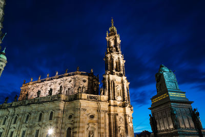 Low angle view of illuminated cathedral against blue sky