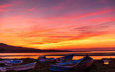 Scenic view of sea against romantic sky at sunset