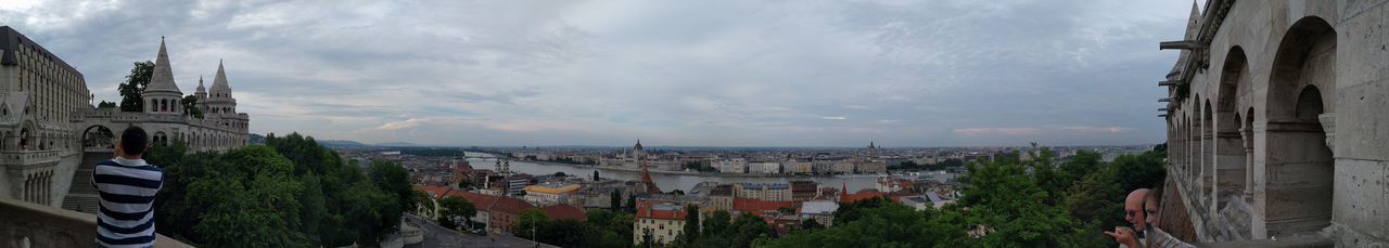 High angle shot of townscape against cloudy sky