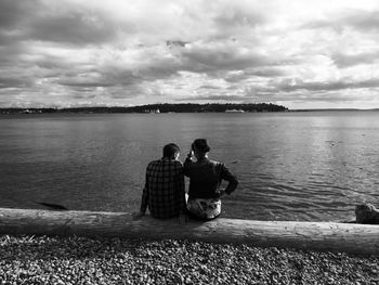 Rear view of man looking at sea