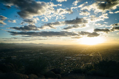 Scenic view of sunset over city