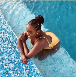 High angle view of woman swimming in pool