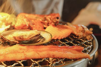 Close-up of meat on barbecue grill