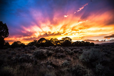 Scenic view of dramatic sky during sunset