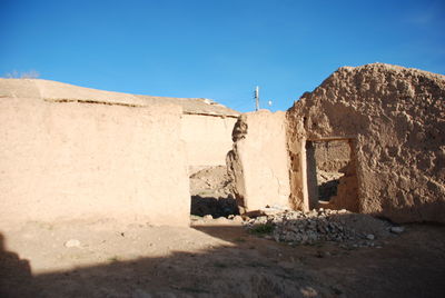 Old building against clear blue sky