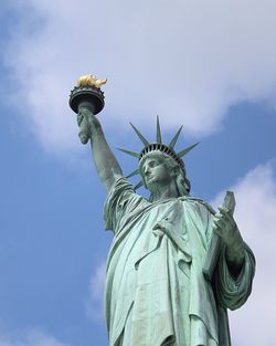 Low angle view of statue against sky