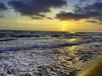 Scenic view of sea against sky during sunset