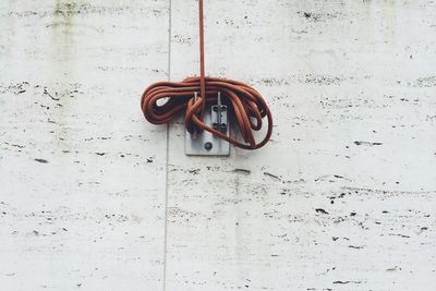 Low angle view of rope on wall