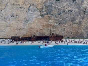 High angle view of tourists on cliff