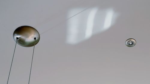 Low angle view of pendant light hanging on ceiling