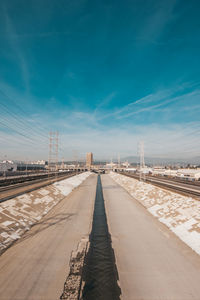 Empty bridge against blue sky with los angeles river