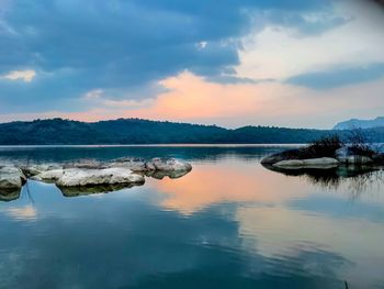 Scenic view of lake against sky during sunset