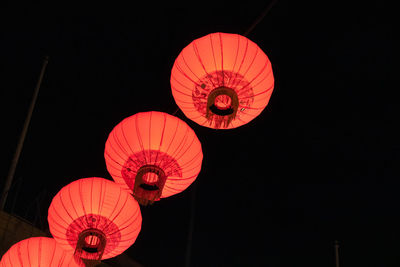Low angle view of illuminated chandelier