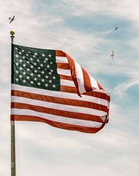 Low angle view of flag against sky