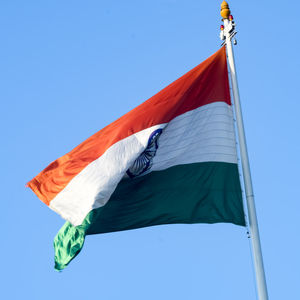 India flag flying high at connaught place with pride in blue sky, india flag fluttering, indian flag