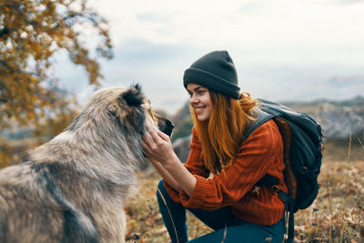 Rear view of a woman with dog