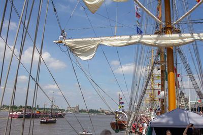 Low angle view of sailboat in sea against sky