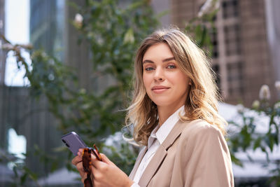 Young woman using mobile phone