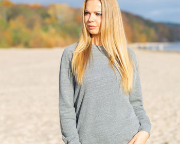 Young woman standing at beach