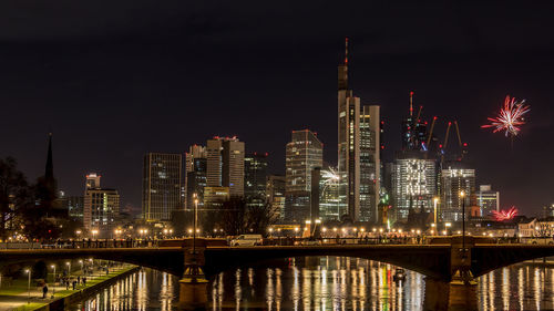 Illuminated buildings in city at night