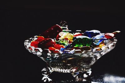 Close-up of multi colored candies against black background