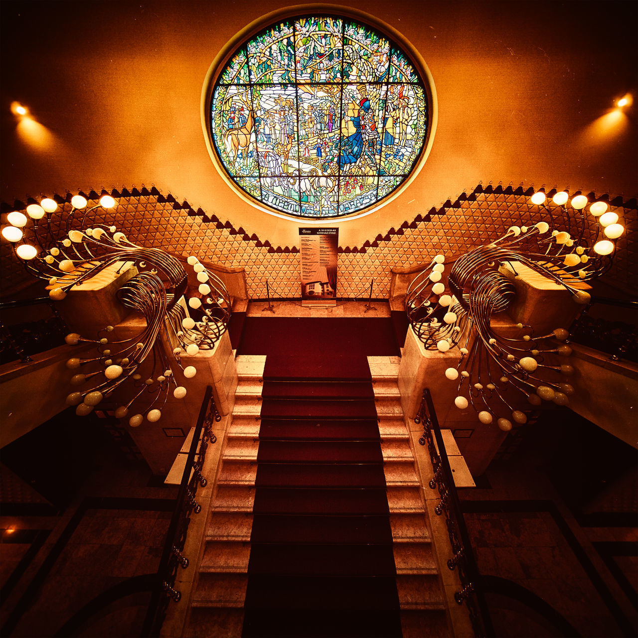 LOW ANGLE VIEW OF ILLUMINATED STEPS AND BUILDING