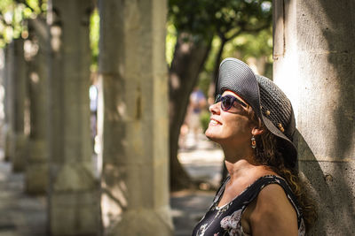 Side view of mature woman wearing sunglasses outdoors