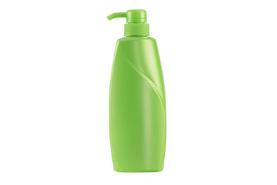 Close-up of green bottle against white background