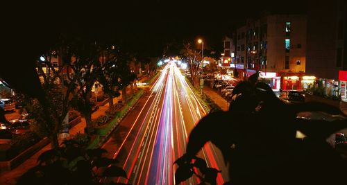 People on illuminated city at night