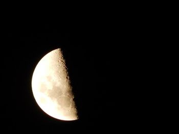 Low angle view of moon in sky at night