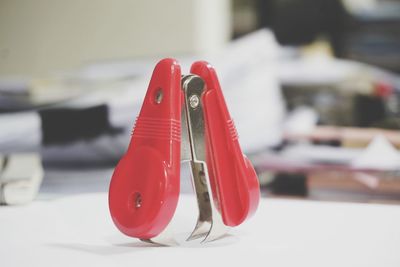 Close-up of red telephone on table at home