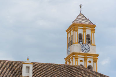 Low angle view of a church tower against sky in spain