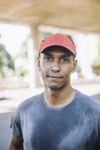 Portrait of man wearing red cap