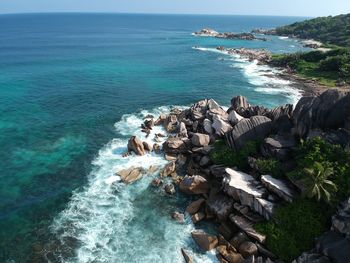 Scenic view of sea against rocks