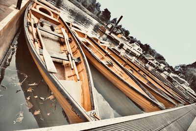 Low angle view of abandoned ship against sky