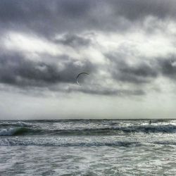 Scenic view of sea against cloudy sky