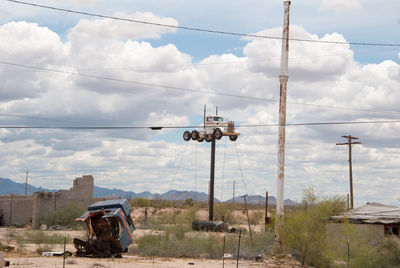 Vintage car on a pipe against sky