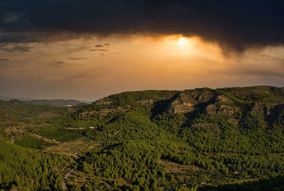 Scenic view of landscape against sky during sunset