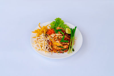 High angle view of food in bowl on white background