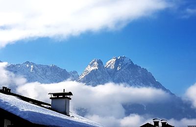 Panoramic view of snowcapped mountains against sky