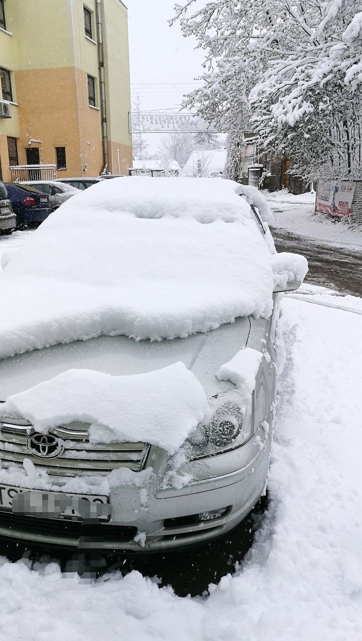 CLOSE-UP OF CAR ON SNOW