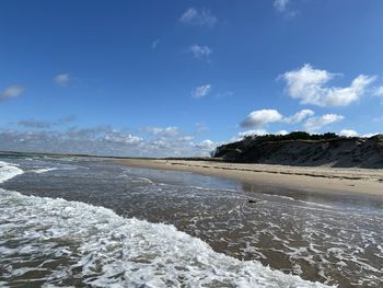 Scenic view of beach against sky