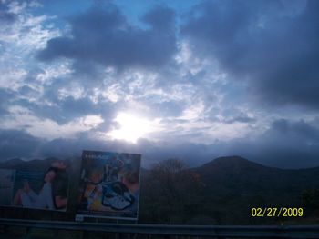 Information sign in city against sky