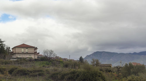House on field against sky