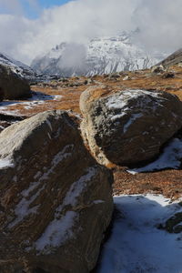 Alpine tundra valley and snowcapped himalaya mountains range in north sikkim near zero point, india