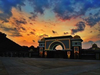 Built structure against sky at sunset